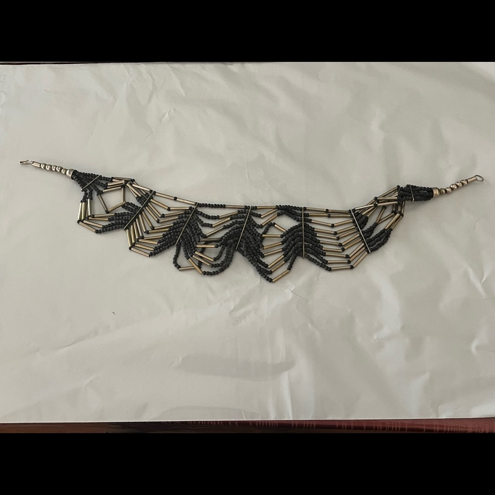 Artisan necklace black beads, silver tubular shapes, larger silver beads m